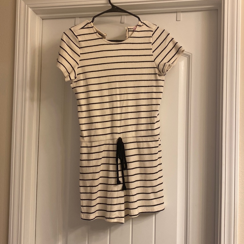Pink Lily black and cream striped romper.